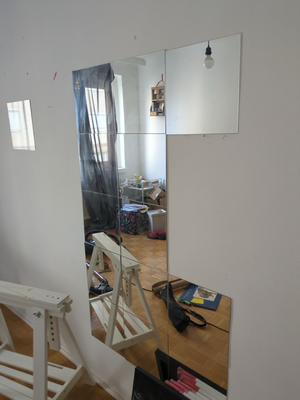The IKEA mirror tile grid stuck to your wall