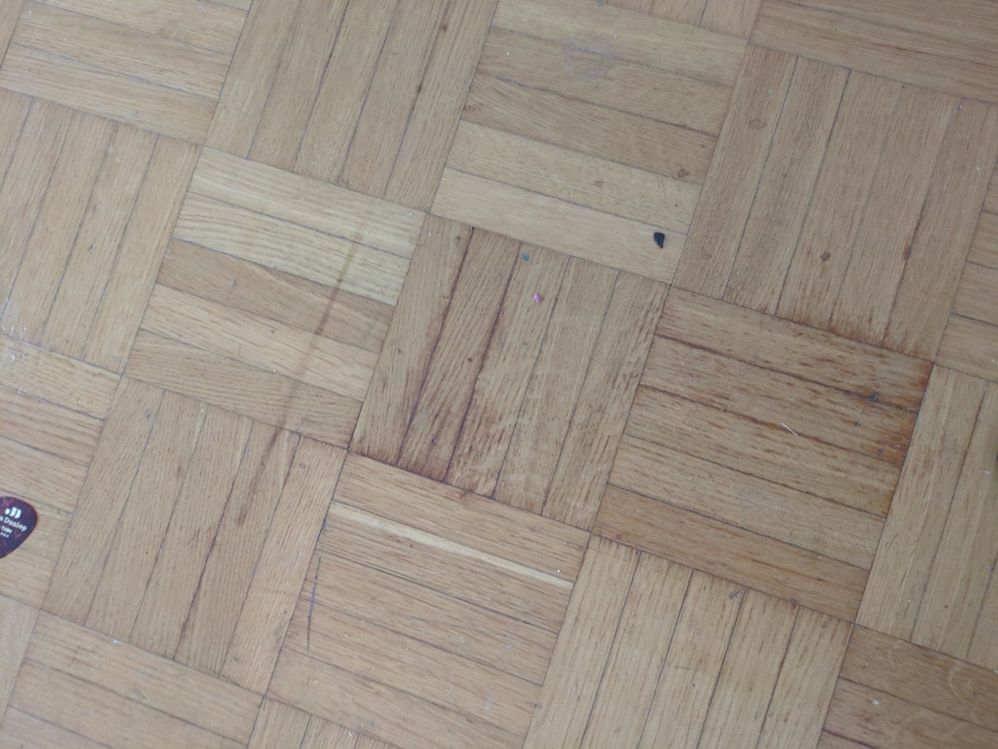 Parquet blocks with surface wear and lighter worn patches